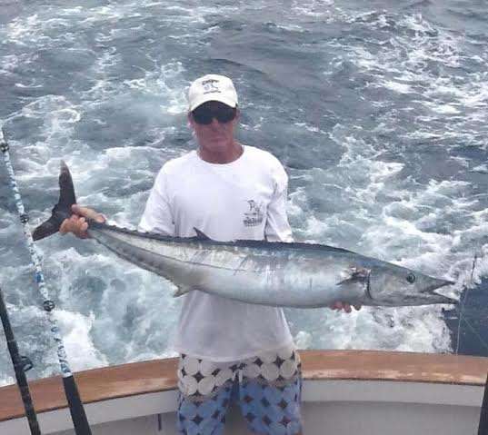 Angler holding a wahoo caught while fishing in Costa Rica