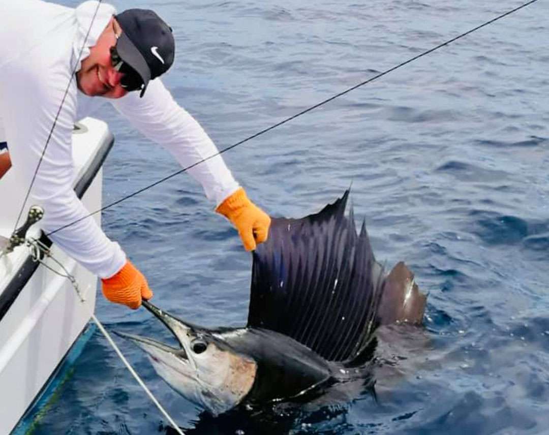Angler with sailfish during a Costa Rica fishing trip